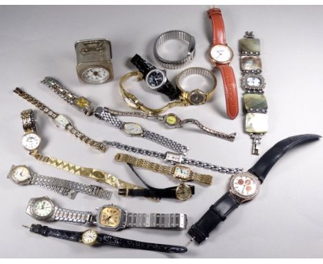 A quantity of ladies wrist watches - including fashion watches and a small alarm clock (qty)