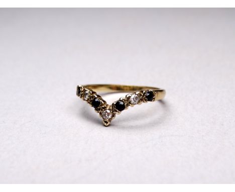 A 9ct gold diamond and gem set ring - with an arrangement of seven stones, size M, weight 1.8g.