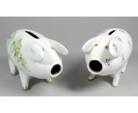 A Rye Pottery piggy bank - decorated with blue flowers, 14cm wide, together with another similar decorated with hops (2)