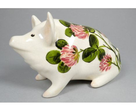 Wemyss Griselda Hill pottery pig - seated, decorated by Ester Weeks with clover flowers, 18cm wide