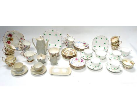 A Delphine bone china tea service - Dawn pattern, six place settings with a sandwich plate, sucrier and milk jug, together wi