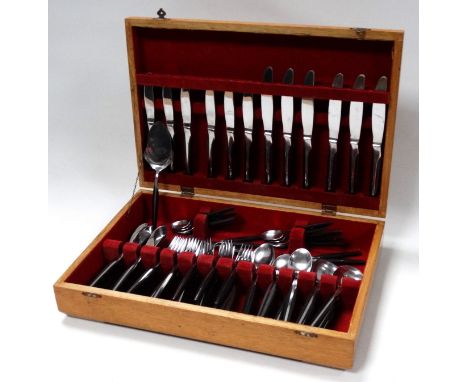 A vintage cutlery service by Eldan - six place settings, including fish eaters and serving items, presented within a canteen.