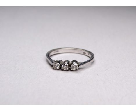 An 18ct white gold three stone diamond ring - size O, weight 2.3g. 