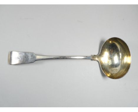 A silver ladle - London 1816, indistinct maker's mark, fiddle back and engraved with initials, weight 186g.