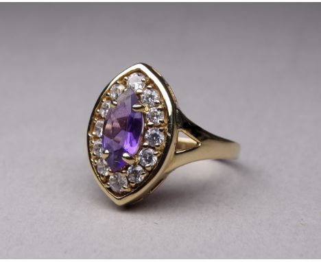 A 9ct gold amethyst and white stone set dress ring - with navette shaped central stone, size N, 3.9g