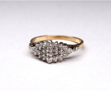 A 9ct gold diamond set dress ring - of stepped navette form, with twenty six stones, weight 2.7g.