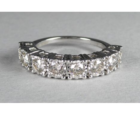 An 9ct white gold eight stone diamond ring - claw set round brilliant cut stones totalling 1.00ct