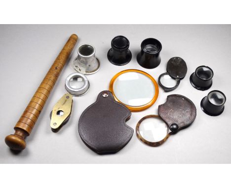 A brass cased jeweller's loupe - with three lenses, together with a small quantity of other loupes and magnifiers and an attr