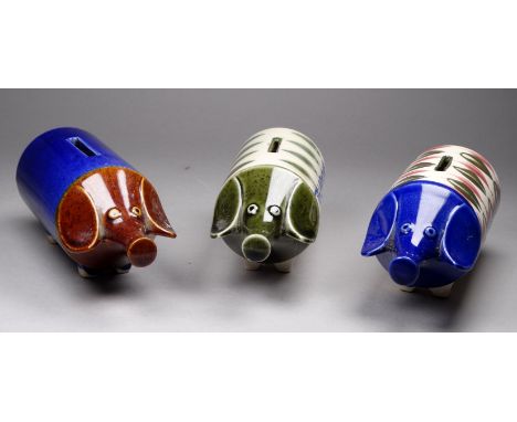A 20th century ceramic piggy bank - of cylindrical form, decorated with a leaf design and marked 'telephone', 15cm long, toge