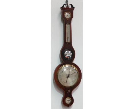 A mid 19th century mahogany cased wheel barometer - the broken swan-neck pediment above a dry/damp dial and thermometer with 