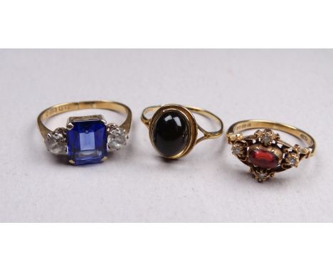 A 9ct gold diamond and garnet dress ring - with a pierced fancy setting, size N, together with two further 9ct gold gem set r