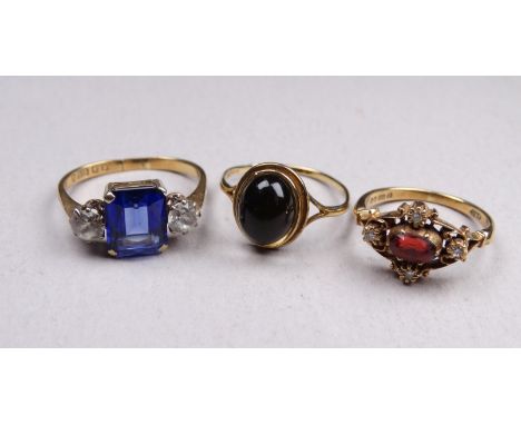 A 9ct gold diamond and garnet dress ring - with a pierced fancy setting, size N, together with two further 9ct gold gem set r