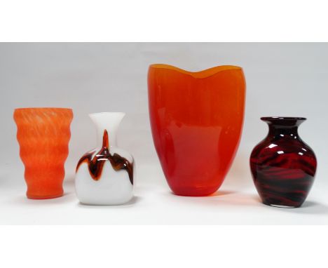 A large contemporary amber glass vase, of bowed tapering form with a wavy rim, 37cm high, together with three other art glass