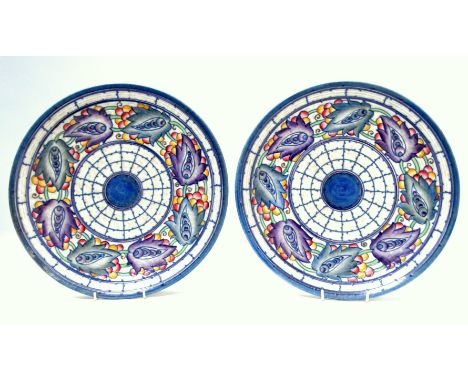 A pair of Crown Ducal chargers by Charlotte Rhead - Tarragona pattern in blue purple colourway, facsimile mark and signature 