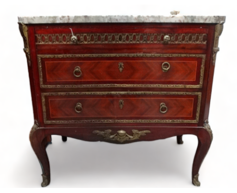 A Louis XVI style marble topped commode - the rectangular top with cusped corners above an arrangement of three drawers, on c