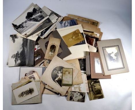 A quantity of early 20th century photographs - including Welsh and Scottish holiday resorts and portrait images.
