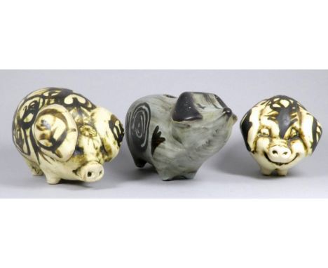 A Rye Pottery piggy bank - grey glazed, 22cm wide, together with two further pottery pigs (3)