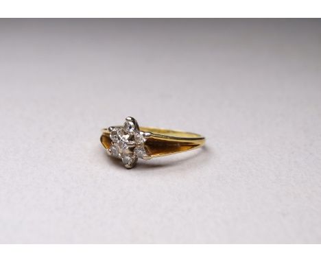 A 9ct gold diamond set ring - the stones mounted in the form of a flower, size M/N, weight 3.2g.