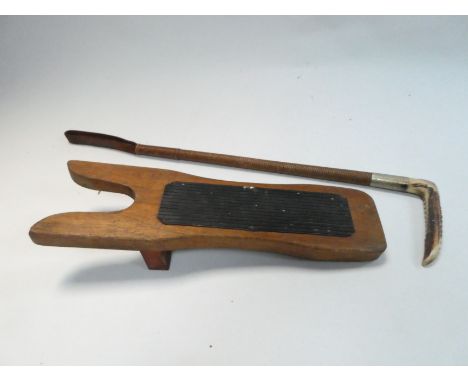 A late 19th century hunting crop - with horn handle, length 63cm, together with a wooden boot hook.