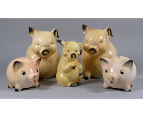 A pair Goebel pottery piggy banks - pink and in a seated pose, 18cm long, together with two further Goebel piggy banks and an