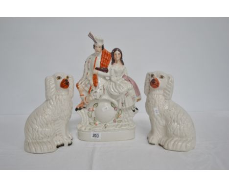 Victorian Staffordshire pottery flat back group with a bag piper and lady sat over a clock, height 13.25', together with a pa