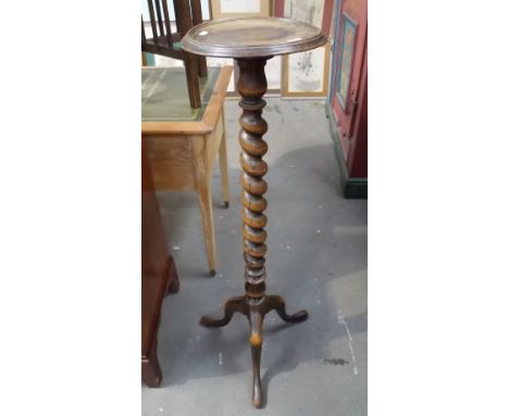 Oak tripod torchiere with a barley twist pillar.