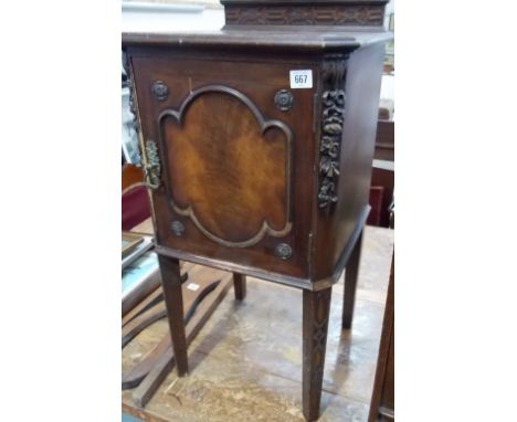 18th Century French style mahogany bedside cupboard, the sides with foliate swag carving, the hinge door revealing a shelf, w