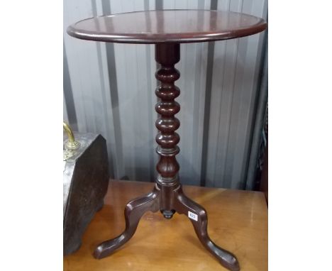 Mahogany tripod table with bobbin turned column and three outswept legs.