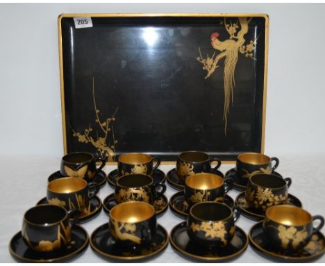 20th Century Japanese black lacquer and gilt painted rectangular tray and 12 cups and saucers, foliate painted and with butte