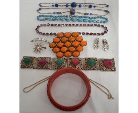 Costume jewellery including an Eastern white metal bangle, a Chinese cinnabar lacquer bangle etc.