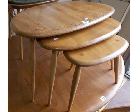 Ercol pale elm 'pebble' nest of three tables.