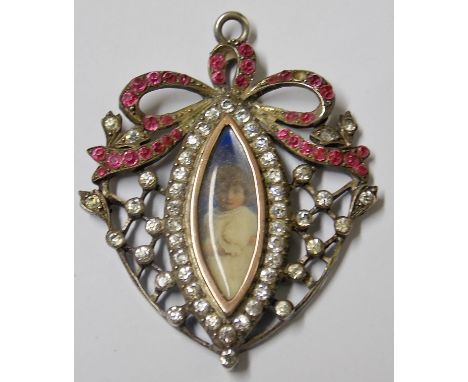 Victorian/Edwardian diamond and ruby white metal mounted mourning brooch, with portrait miniature of an infant child within a