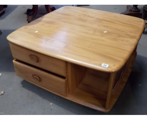 Good Ercol pale elm square two tier coffee table with two drawers upon casters, width 31'.