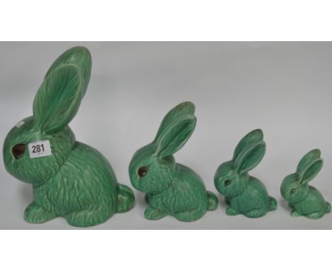 Sylvac pottery set of four graduated green glazed model rabbits, the largest height 9.75'.