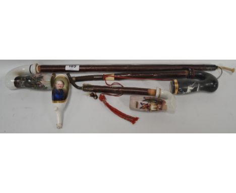 Four various German pottery smokers pipes, one painted with a portrait of a gentleman (4).