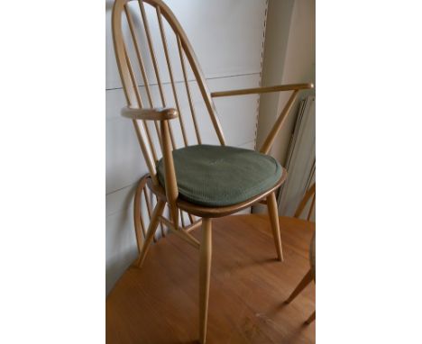 Ercol pale ash and elm arched spindle back arm chair.