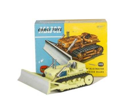 A Corgi Major Toys 1102 Euclid TC-12 Tractor With Dozer Blade, pale lime green body, blue engine, black rubber tracks, in ori