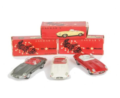Tekno 927 Jaguar E Type, three examples, first red body, off-white interior, bare metal hubs, second white body, red interior