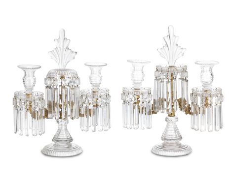 A pair of cut glass and gilt metal twin-branch candelabraLate 19th CenturyWith a central flame finial and mounted with sets o