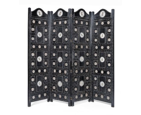 An Indian ebonised hardwood and metal mounted four panel screenWith pierced sunburst and incised decoration, each panel: 50cm