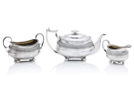 A George III three piece Scottish silver tea serviceby John Mckay, Edinburgh 1814 Each of oblong form on four bun feet, with 