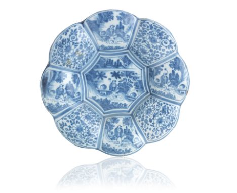 A Frankfurt faience lobed dish (Buckelplatte)18th CenturyPainted in blue with a central panel of a chinoiserie figure in a la