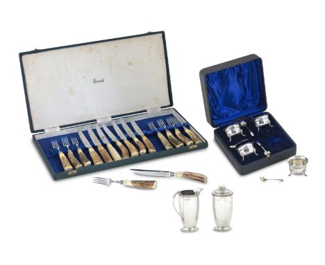 A collection of cased silvervarious makers and dates To include a sugar and cream set, the caster and jug with Celtic borders