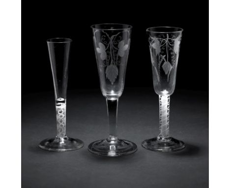 Two ale glasses and a ratafia glass18th CenturyThe first with plain stem engraved with hops and barley, the second with opaqu