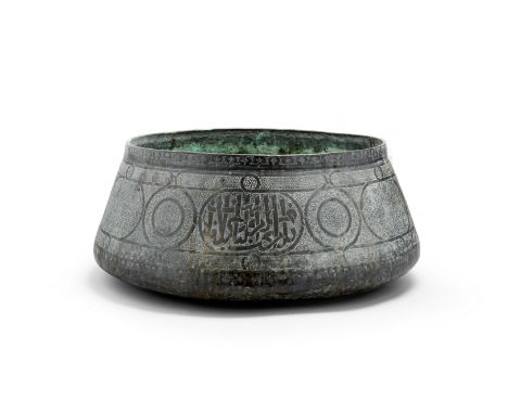 A Mamluk style copper basin19th centuryOf tapering circular form, decorated with roundels and interlocking geometric patterns
