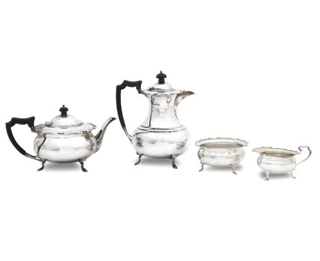 A modern four piece silver tea serviceby H.Atkins, Sheffield 1924/25 Each on three pad feet and with scalloped rims, the pots