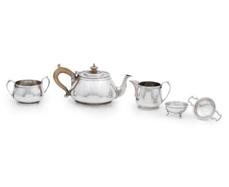 A three piece silver tea serviceby Edward Barnard &amp; Sons Ltd, London 1969/70 Of squat circular form, the teapot with wood