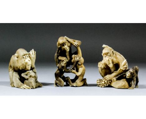 Three Japanese carved and stained ivory okimono - Monkey feeding his youngster, 2.5ins (6.4cm) high, a group of three monkeys