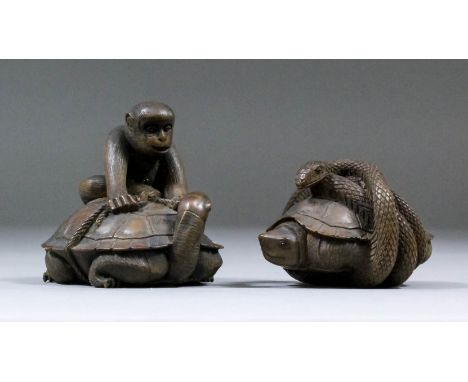 A Japanese carved boxwood netsuke of a monkey astride a turtle tying a knot in a rope, the turtle with its head turned back, 