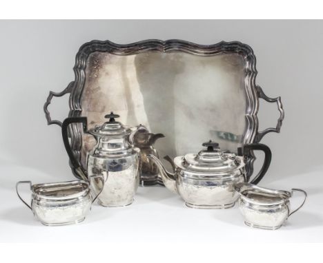 A George V silver rectangular four piece tea service with moulded rim, the bodies engraved with leaf and swag ornament, with 